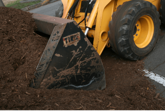 an image of a bucket attached to a skid steer loader