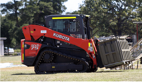 an image of a forklift forks attached to a skid steer loader